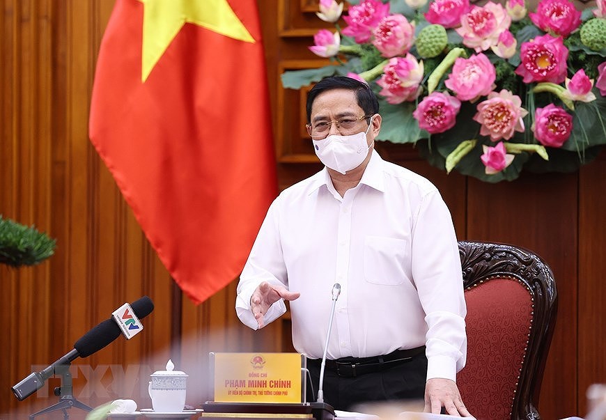 越南政府总理范明政：研究建立新冠疫苗基金 hinh anh 1