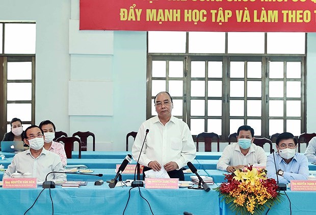 State President holds working session with Cu Chi, Hoc Mon districts in HCM City hinh anh 2
