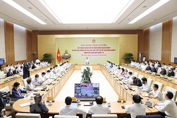 PM, business circle discuss ways to tackle pandemic-caused difficulties hinh anh 2