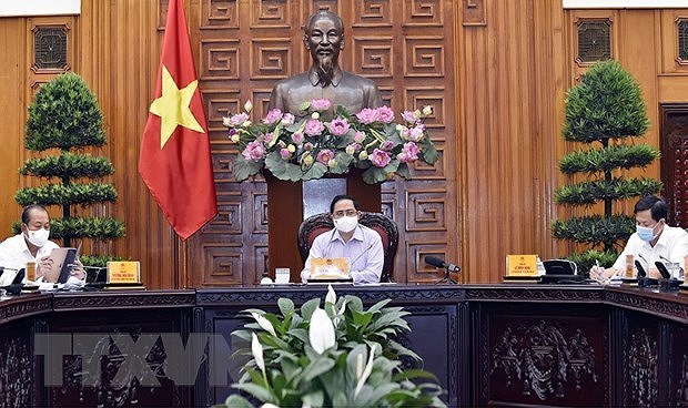 Premier vietnamita insta a preparar labores electorales en caso de brotes del COVID-19 hinh anh 1
