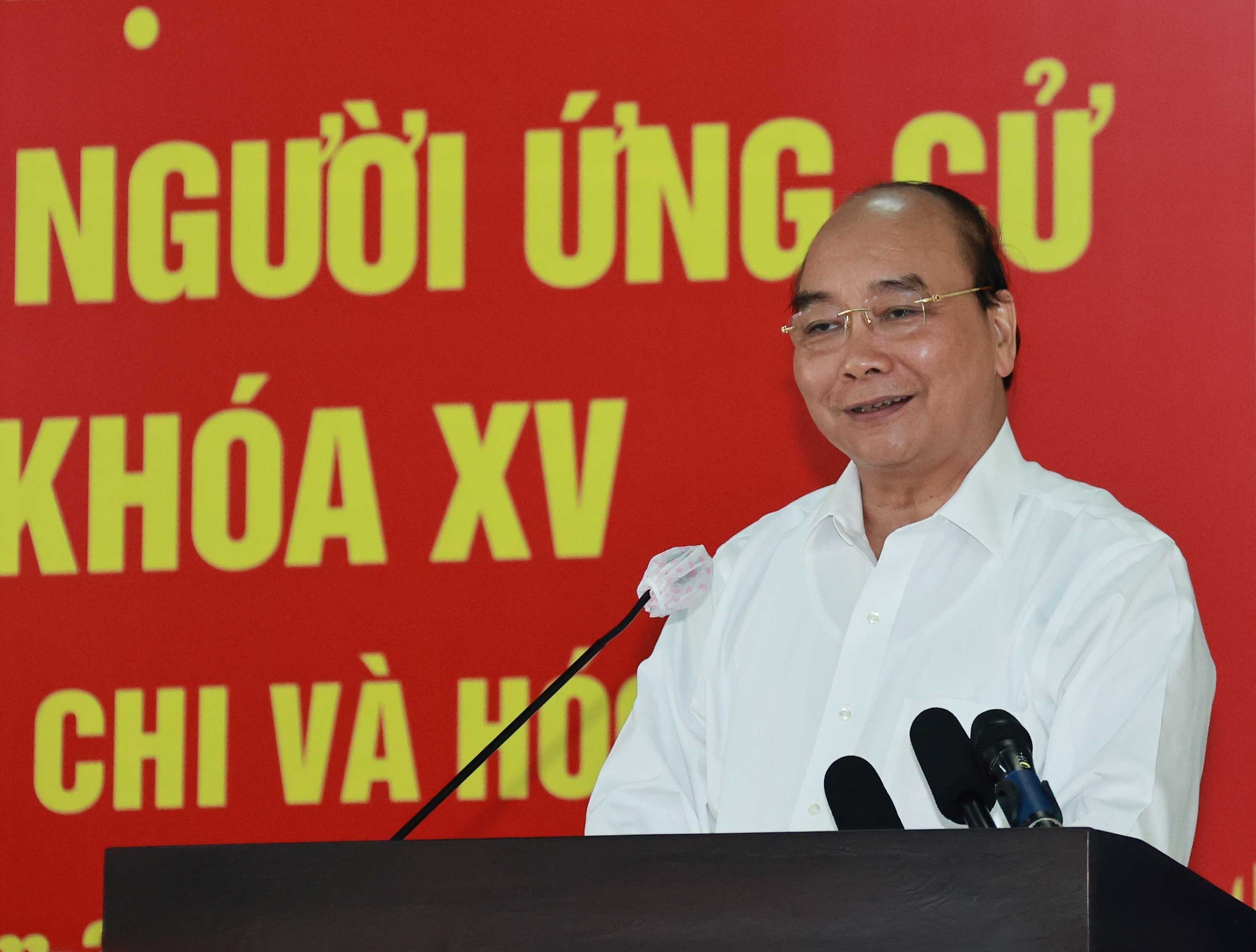 Le president Nguyen Xuan Phuc en tournee dans les districts de Cu Chi et Hoc Mon a HCM-Ville hinh anh 2
