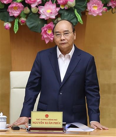 Le PM Nguyen Xuan Phuc demande a Hanoi de relancer son economie hinh anh 1