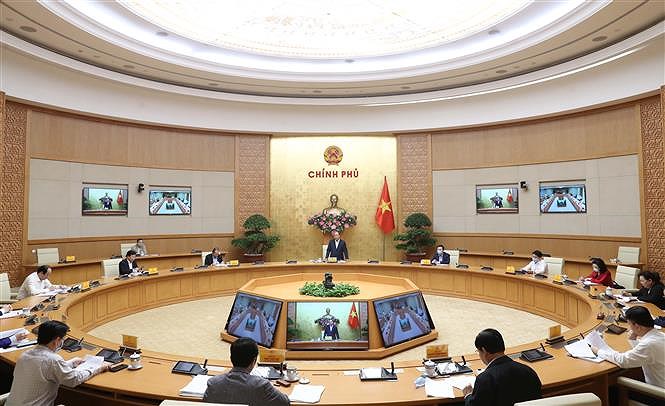 Le PM Nguyen Xuan Phuc demande a Hanoi de relancer son economie hinh anh 2